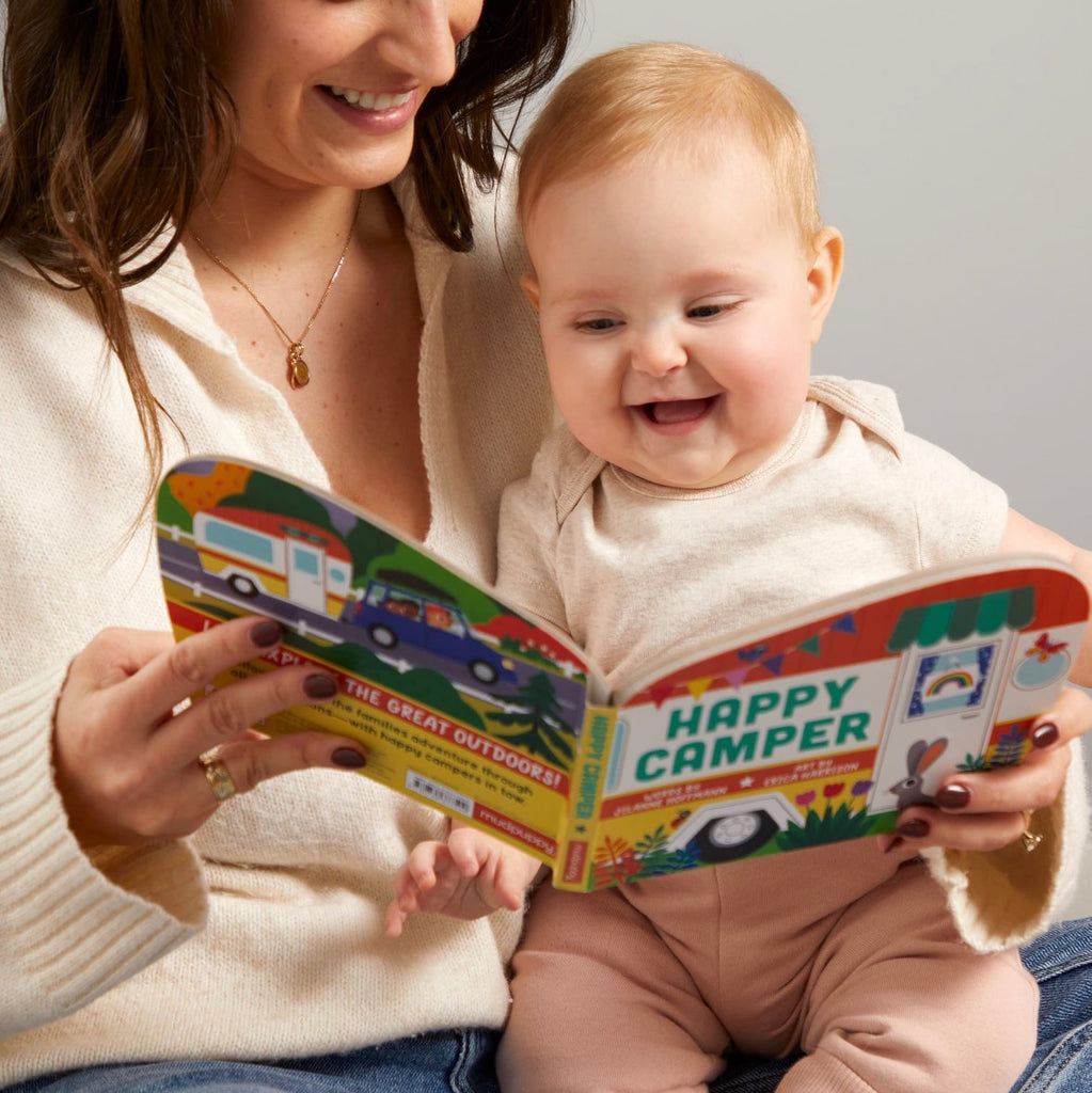 mum and baby reading a board book together